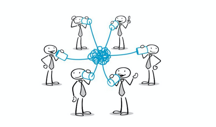 Stick figures of people talking to each other between a tangled mess of cables